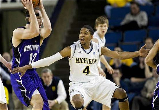 Darius Morris (4) and Matt Vogrich (13)