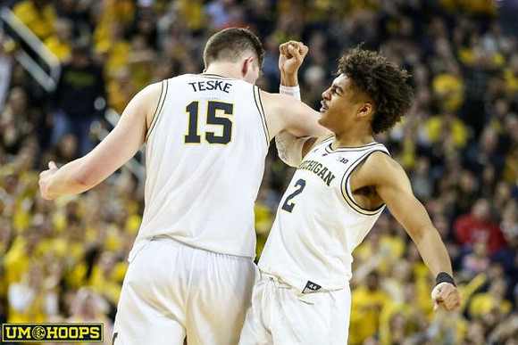 Jon Teske (15) and Jordan Poole (2)