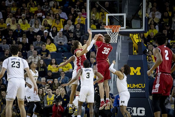 Brandon Johns Jr. (23), Charles Matthews (1), Zavier Simpson (3), and Isaiah Livers (4)