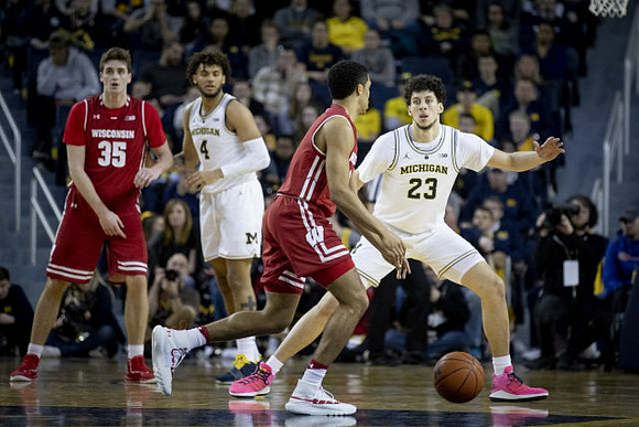 Isaiah Livers (4) and Brandon Johns Jr. (23)