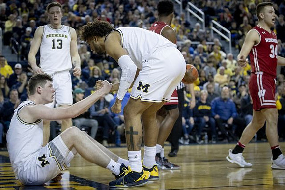 Jon Teske (15), Isaiah Livers (4), and Ignas Brazdeikis (13)