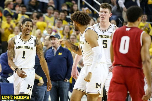 Charles Matthews (1), Isaiah Livers (4), and Jon Teske (15)