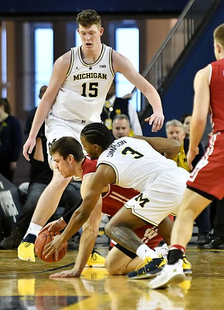 Jon Teske (15) and Zavier Simpson (3)
