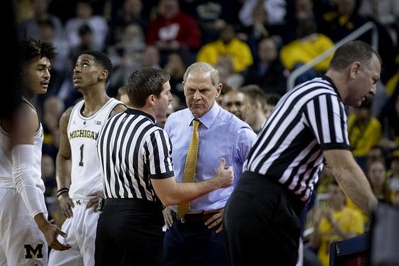 Jordan Poole (2), Charles Matthews (1), and John Beilein