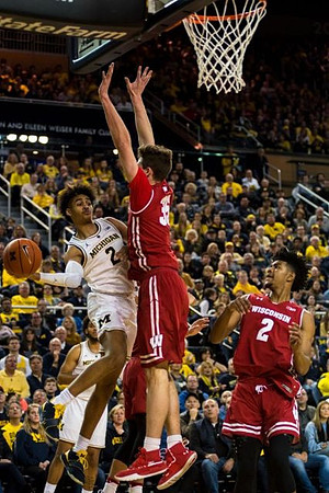 Zavier Simpson (3) and Isaiah Livers (4)