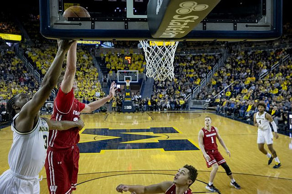 Zavier Simpson (3) and Isaiah Livers (4)
