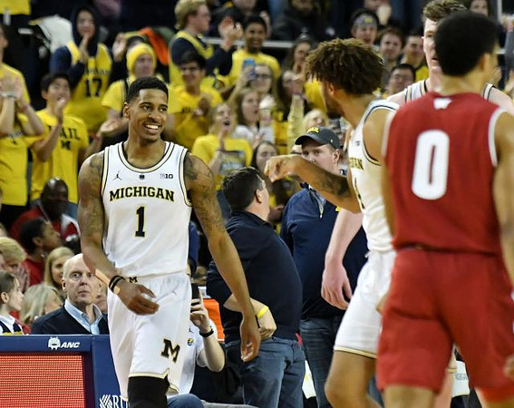 Charles Matthews (1), Isaiah Livers (4), and Jon Teske (15)