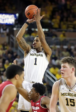 Charles Matthews (1) and Jon Teske (15)