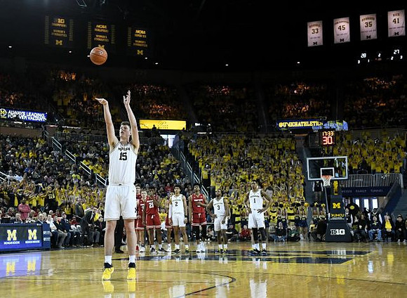 Jon Teske (15), Jordan Poole (2), Zavier Simpson (3), and Charles Matthews (1)