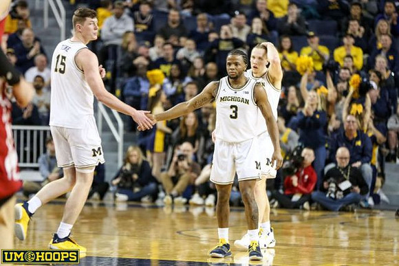 Jon Teske (15), Zavier Simpson (3), and Ignas Brazdeikis (13)