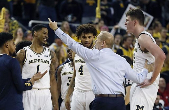 Charles Matthews (1), Zavier Simpson (3), Isaiah Livers (4), John Beilein, and Jon Teske (15)