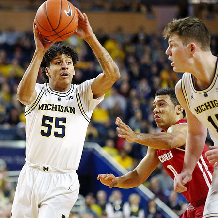 Eli Brooks (55) and Jon Teske (15)