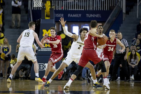Jon Teske (15), Jordan Poole (2), and Charles Matthews (1)