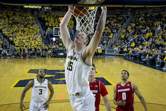 Zavier Simpson (3) and Jon Teske (15)