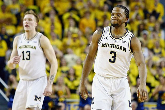 Ignas Brazdeikis (13) and Zavier Simpson (3)