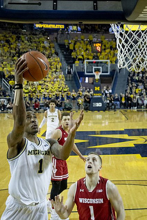 Charles Matthews (1) and Jordan Poole (2)