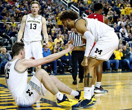 Jon Teske (15), Ignas Brazdeikis (13), and Isaiah Livers (4)