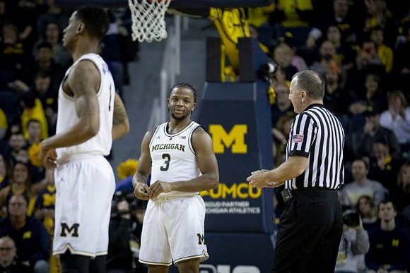 Charles Matthews (1) and Zavier Simpson (3)