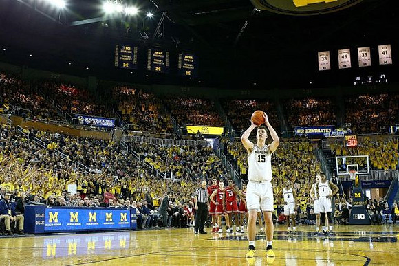 Jon Teske (15), Zavier Simpson (3), Ignas Brazdeikis (13), and Charles Matthews (1)