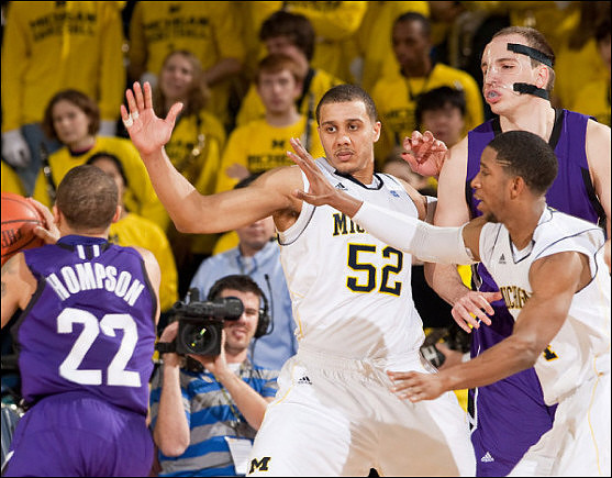 Jordan Morgan (52) and Darius Morris (4)
