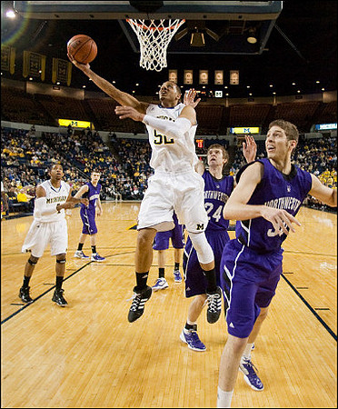 Darius Morris (4) and Jordan Morgan (52)