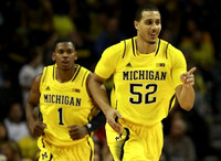 Glenn Robinson III (1) and Jordan Morgan (52)