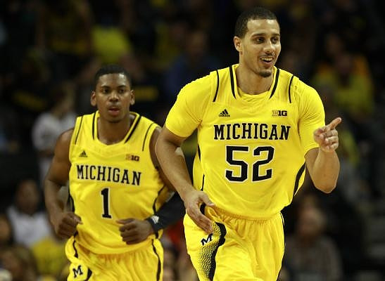 Glenn Robinson III (1) and Jordan Morgan (52)