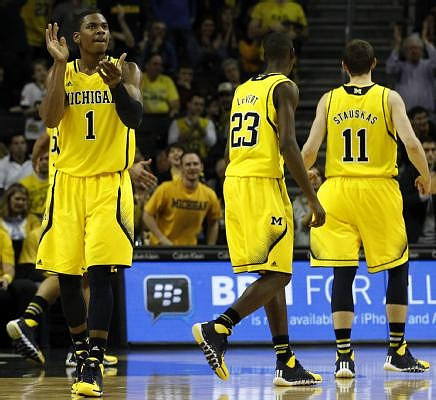 Glenn Robinson III (1), Caris LeVert (23), and Nik Stauskas (11)