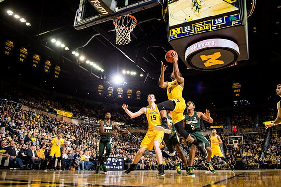 Muhammad-Ali Abdur-Rahkman (12), D.J. Wilson (5), Xavier Simpson (3), and Zak Irvin (21)
