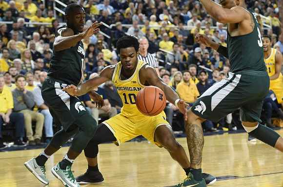 Derrick Walton Jr. (10) and Zak Irvin (21)