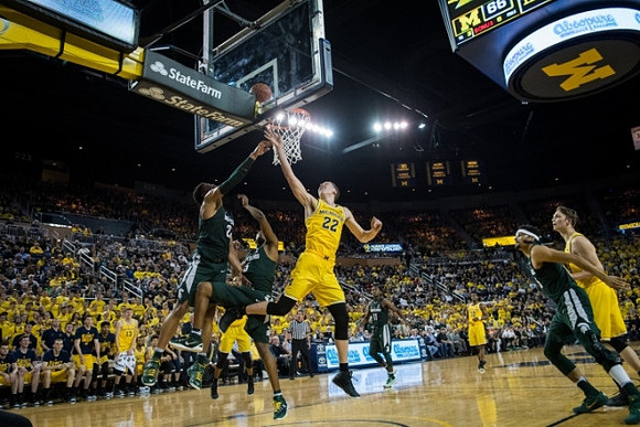 Duncan Robinson (22) and Mark Donnal (34)