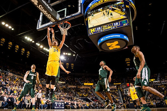 Mark Donnal (34) and Derrick Walton Jr. (10)