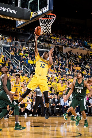 D.J. Wilson (5) and Muhammad-Ali Abdur-Rahkman (12)