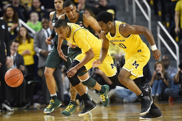 Muhammad-Ali Abdur-Rahkman (12) and Derrick Walton Jr. (10)