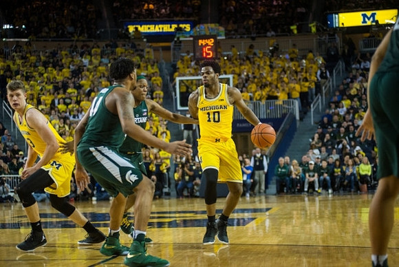 Moritz Wagner (13) and Derrick Walton Jr. (10)