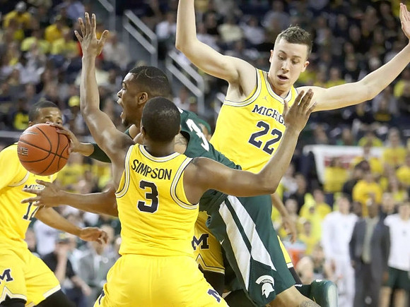 Muhammad-Ali Abdur-Rahkman (12), Xavier Simpson (3), and Duncan Robinson (22)