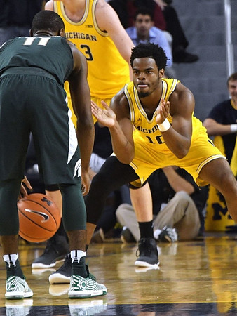 Moritz Wagner (13) and Derrick Walton Jr. (10)