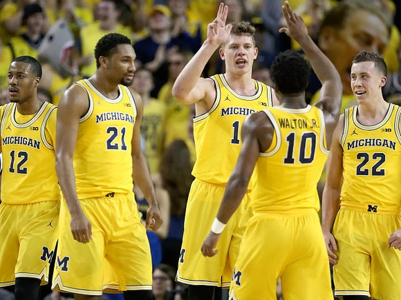 Muhammad-Ali Abdur-Rahkman (12), Zak Irvin (21), Moritz Wagner (13), Derrick Walton Jr. (10), and Duncan Robinson (22)