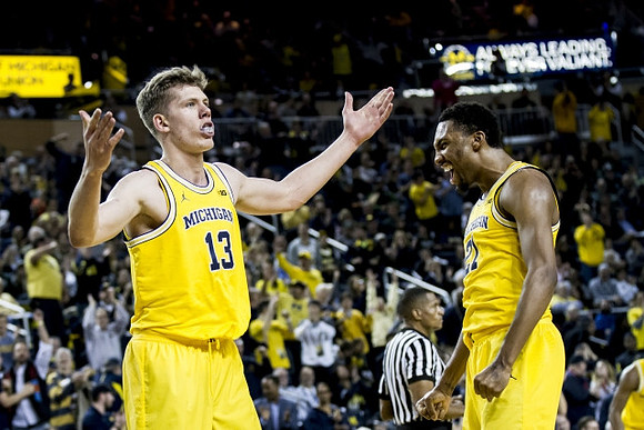 Moritz Wagner (13) and Zak Irvin (21)
