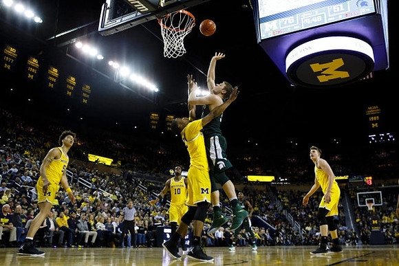 D.J. Wilson (5), Derrick Walton Jr. (10), Muhammad-Ali Abdur-Rahkman (12), and Moritz Wagner (13)