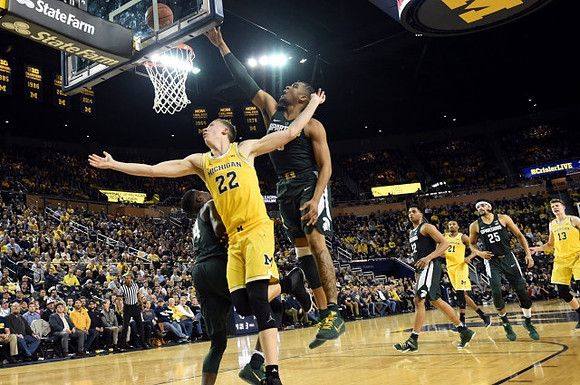 Duncan Robinson (22), Zak Irvin (21), and Moritz Wagner (13)