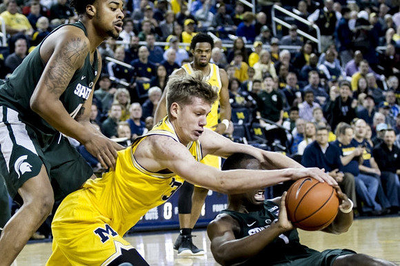 Moritz Wagner (13) and Derrick Walton Jr. (10)