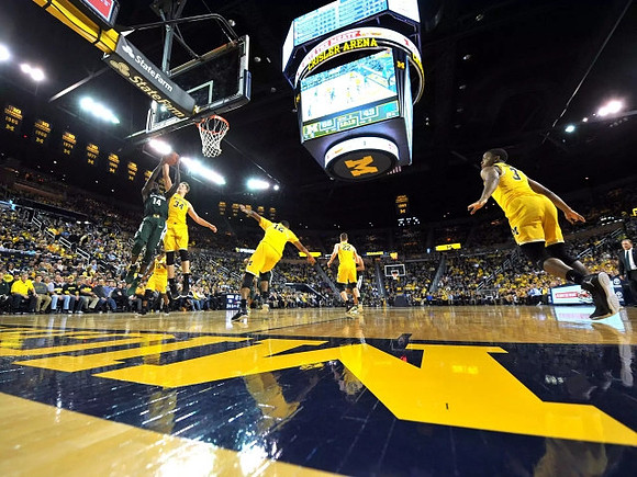 Derrick Walton Jr. (10), Mark Donnal (34), Muhammad-Ali Abdur-Rahkman (12), Duncan Robinson (22), and Xavier Simpson (3)