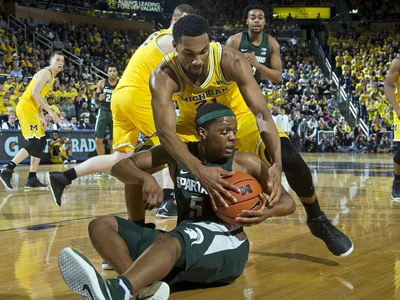 Duncan Robinson (22), Jon Teske (15), and Zak Irvin (21)