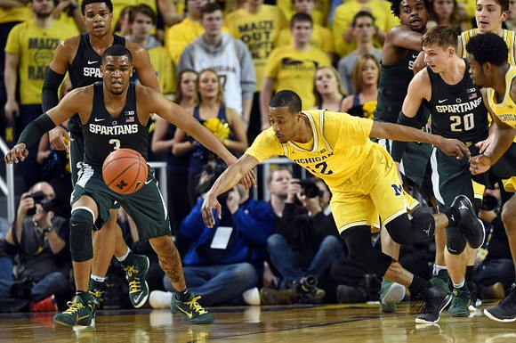 Muhammad-Ali Abdur-Rahkman (12) and Derrick Walton Jr. (10)
