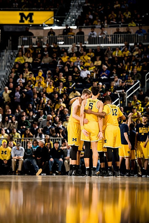 Moritz Wagner (13), D.J. Wilson (5), and Muhammad-Ali Abdur-Rahkman (12)