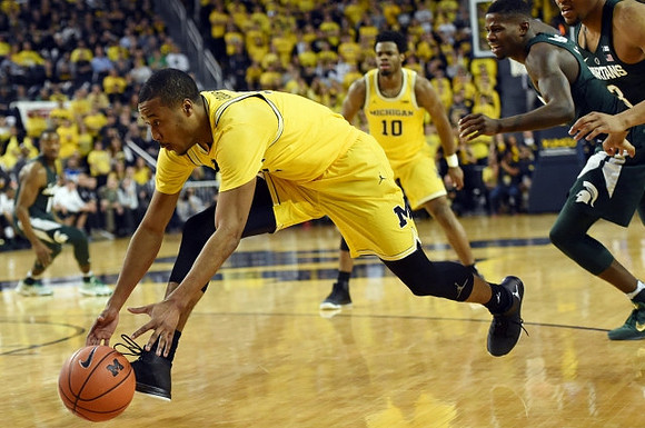Muhammad-Ali Abdur-Rahkman (12) and Derrick Walton Jr. (10)