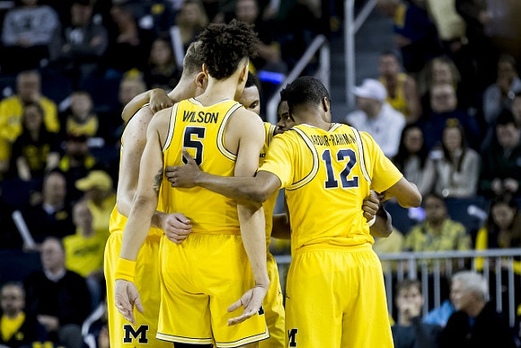 D.J. Wilson (5), Moritz Wagner (13), Zak Irvin (21), Muhammad-Ali Abdur-Rahkman (12), and Derrick Walton Jr. (10)