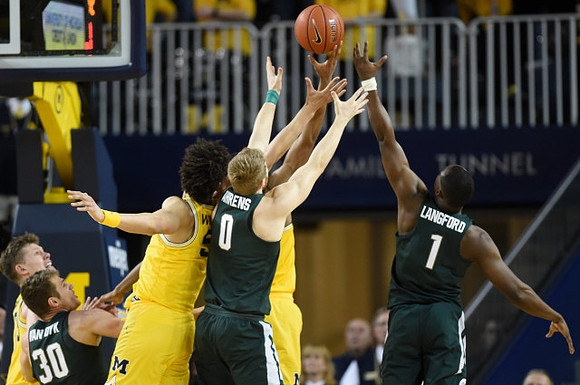 D.J. Wilson (5) and Moritz Wagner (13)