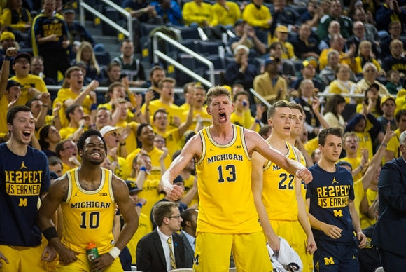 Derrick Walton Jr. (10), Moritz Wagner (13), and Michigan Team